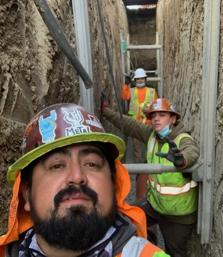 Construction workers in underground tunnel excavation